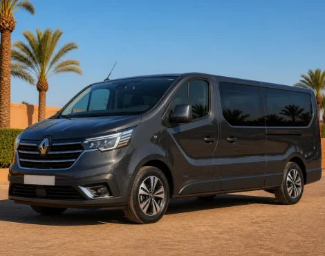 Pristine graphite Renault Trafic passenger minibus in a palm-lined Marrakech fleet yard